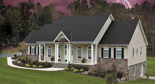 Tan colored home with white trim and gutters.